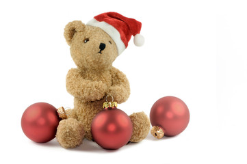 Teddybär mit Mütze und Kugeln