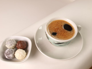 Cup of coffee with fine chocolate