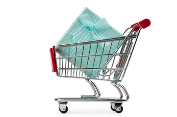 Shopping cart and giftboxes on white