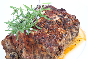 Roast pork decorated with savory blooming twigs