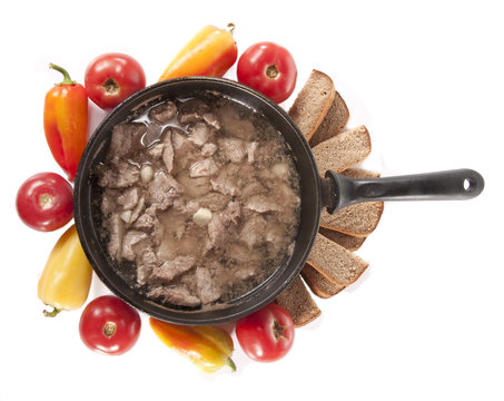 Frying pan with meat and vegetables