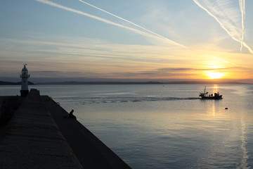 Fototapeta na wymiar Leaving harbour in the early morning, Mevagissey , Cornwall