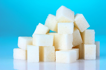 refined sugar on blue background