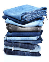 lot of blue jeans isolated on white