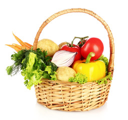 vegetables in a basket isolated on white