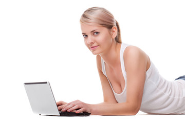 woman laying on the floor with laptop