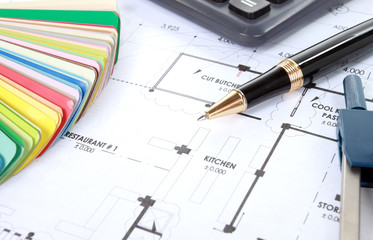 heap of design and project drawings on table