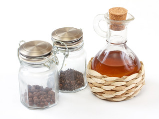 vinegar bottle, spices on the white