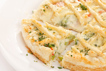 tasty quiche with cheese and herbs