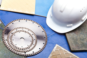 Diamond discs for cutting of tile and a helmet on a tile