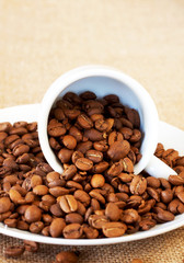 Cup filled with coffee beans