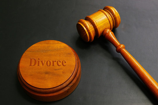 judges gavel with divorce text, on black