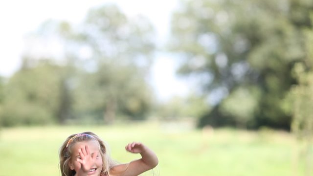 four children jumping outdoor and having fun