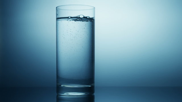 pouring water in glass