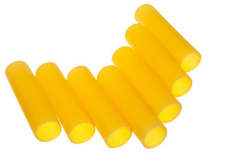Italian cannelloni pasta tubes isolated over white background.