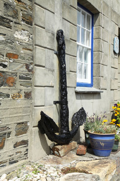 Ship anchor on front of house in Mevagissey, Cornwall