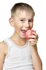 boy eating red apple