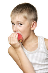 boy eating red apple