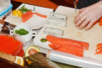chef preparing sushi in the kitchen