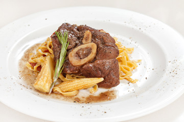 tasty steak with pasta