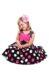 Little girl in a pretty pink dress