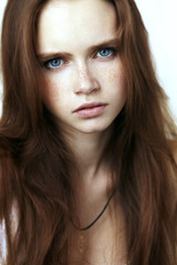 Young beautiful women with freckles