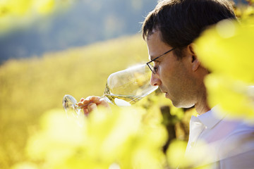 Wine grower tasting wine.