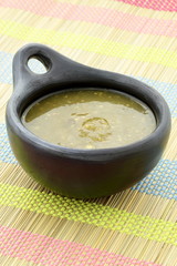 tomatillo sauce in colombian clay dish