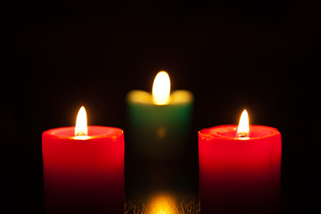 three candles burning