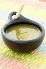 tomatillo sauce in colombian clay dish