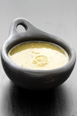 tomatillo sauce in colombian clay dish