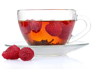 black tea and raspberry in cup isolated on white