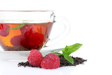 black tea, mint and raspberry in cup isolated on white