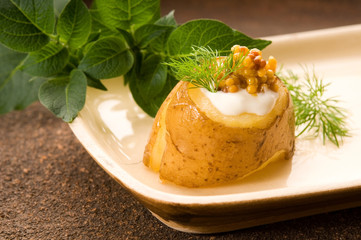 Baked potato with sour cream, grain Dijon mustard and herbs