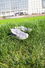 Children's footwear on a green grass
