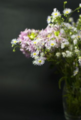 Bouquet of wild flowers on a black background