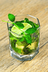 Alcoholic beverage of lime and mint in glass – Mochito