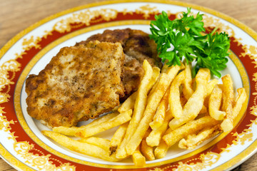 Fried potatoes  with meat cutlet