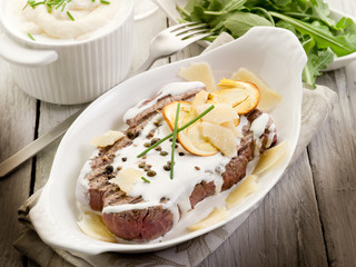 tenderloin with cream sauce ovum mushroom and arugula salad