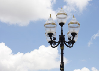 Fototapeta na wymiar antique lamp post on blue sky