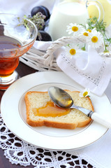 Still life with honey and a slice of bread.
