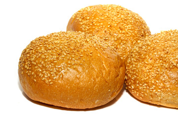 Loaf of bread and rolls isolated on white