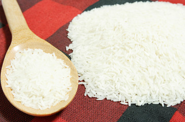 rice grain and wooden spoon