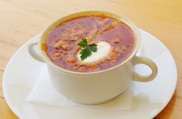 Soup with sour cream on the plate