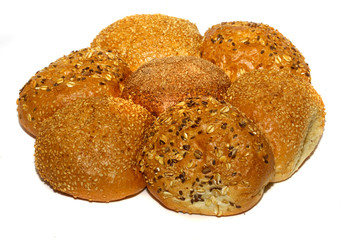 Loaf of bread and rolls isolated on white
