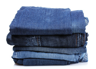 lot of blue jeans isolated on white