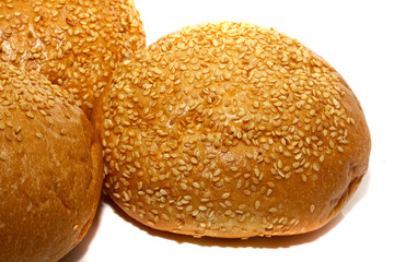 Loaf of bread and rolls isolated on white