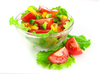 many vegetables on the plate isolated on white