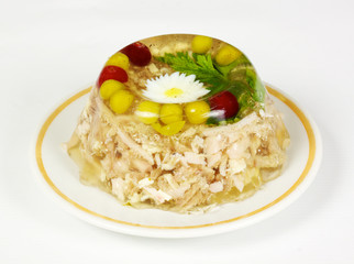Aspic from chicken meat decorated with eggs and parsley