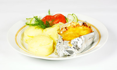 Baked Potato filled with meat and cheese on white plate